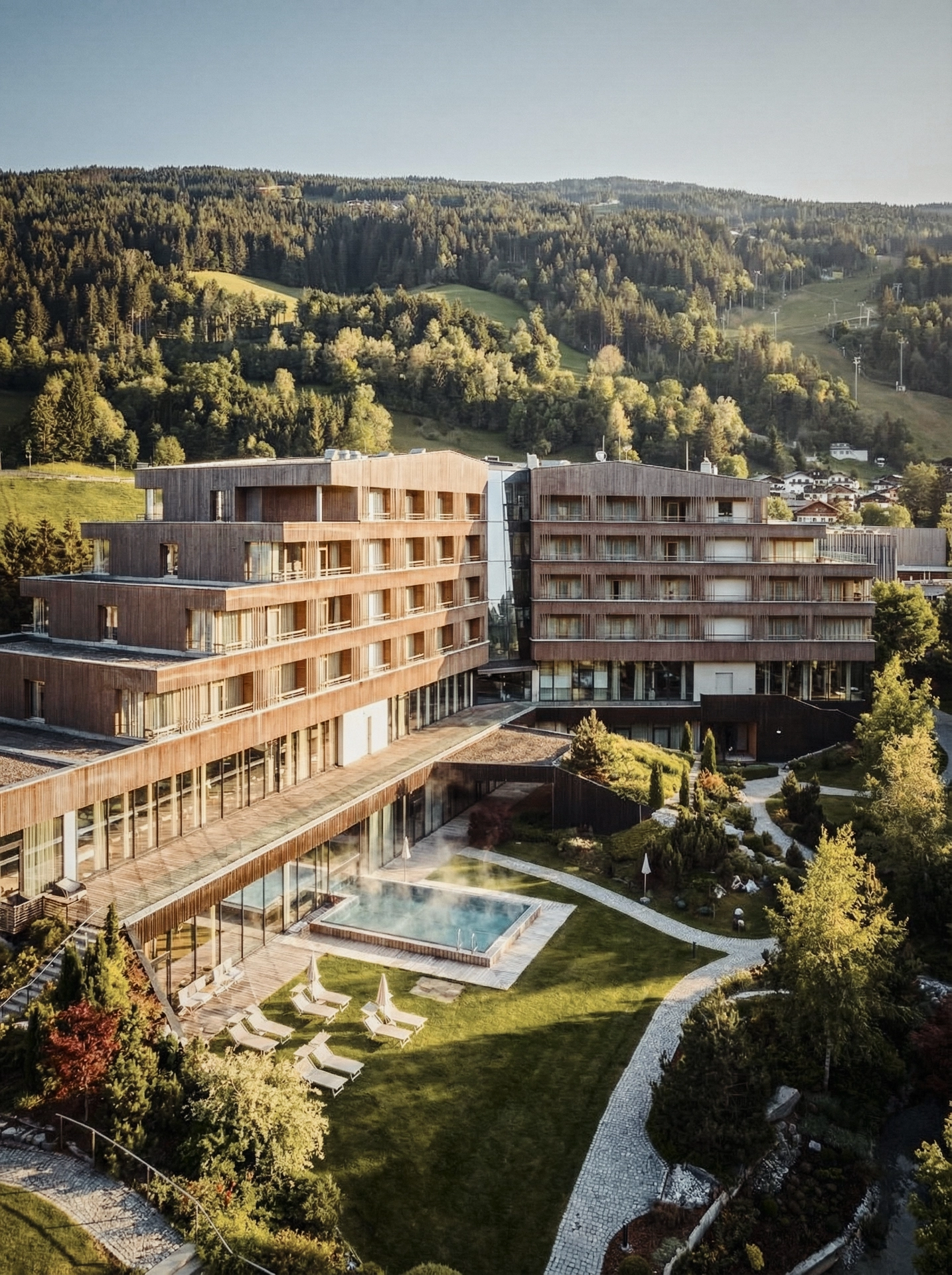 Aerial drone view of a hotel and surrounding landscape