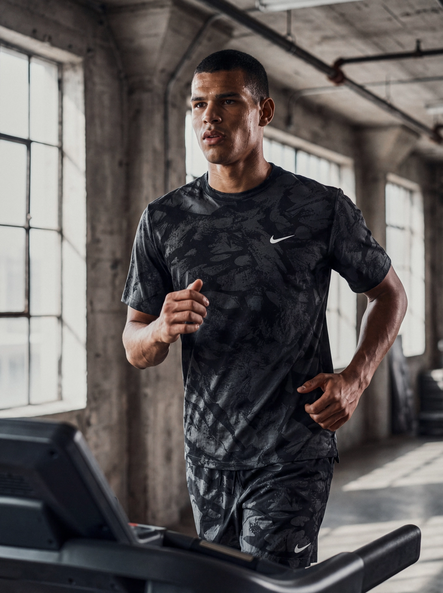 Editorial fitness portrait of an athlete in a modern indoor gym